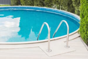 Swimming pool. Blue water. Backyard